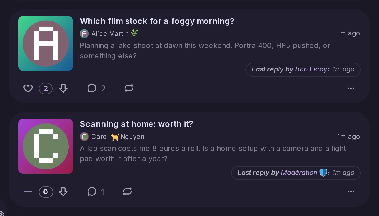 Two forum topics, each with its title, author and last reply, and below it a score between the like and downvote buttons: 2 for the first, 0 for the second, which got a downvote.